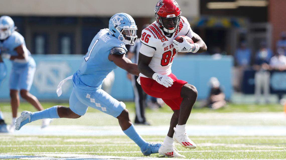 N.C. State wide receiver Emeka Emezie (86) beats to North Carolina defensive back Kyler McMichael (1) to score on a 42-yard touchdown during the first half of N.C. State’s game against UNC at Kenan Stadium in Chapel Hill, N.C., Saturday, Oct. 24, 2020.