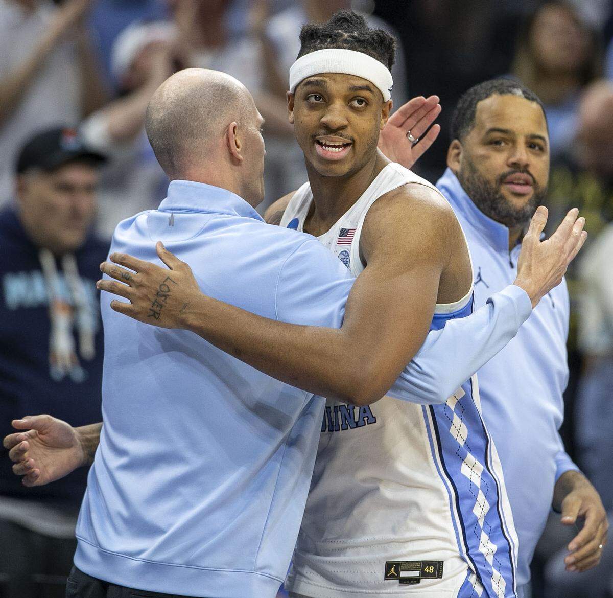 North Carolina coach Brad Frederick embraces Armando Bacot (5) as the starters come out of the game, after securing their victory over Saint Peter’s in the NCAA East Regional final on Sunday, March 27, 2022 at Wells Fargo Center in Philadelphia, Pa.