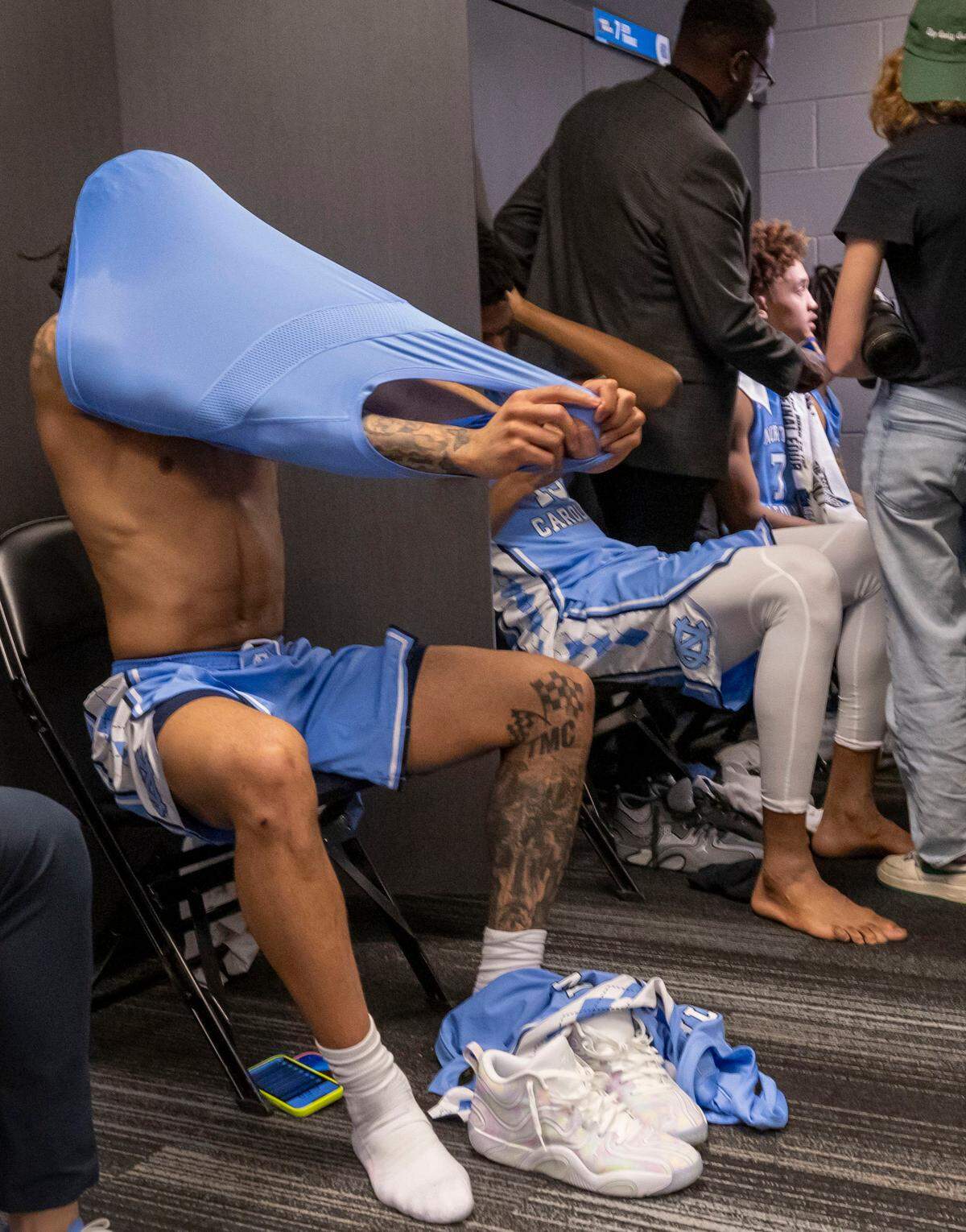 North Carolina guard R.J. Davis (4) removes his jersey in theTar Heels’ locker room following the Tar Heels’ 71-64 loss to Ole Miss in the first round of the NCAA Tournament t on Friday, March 21, 2025 at Fiserv Forum in Milwaukee, Wisconsin.