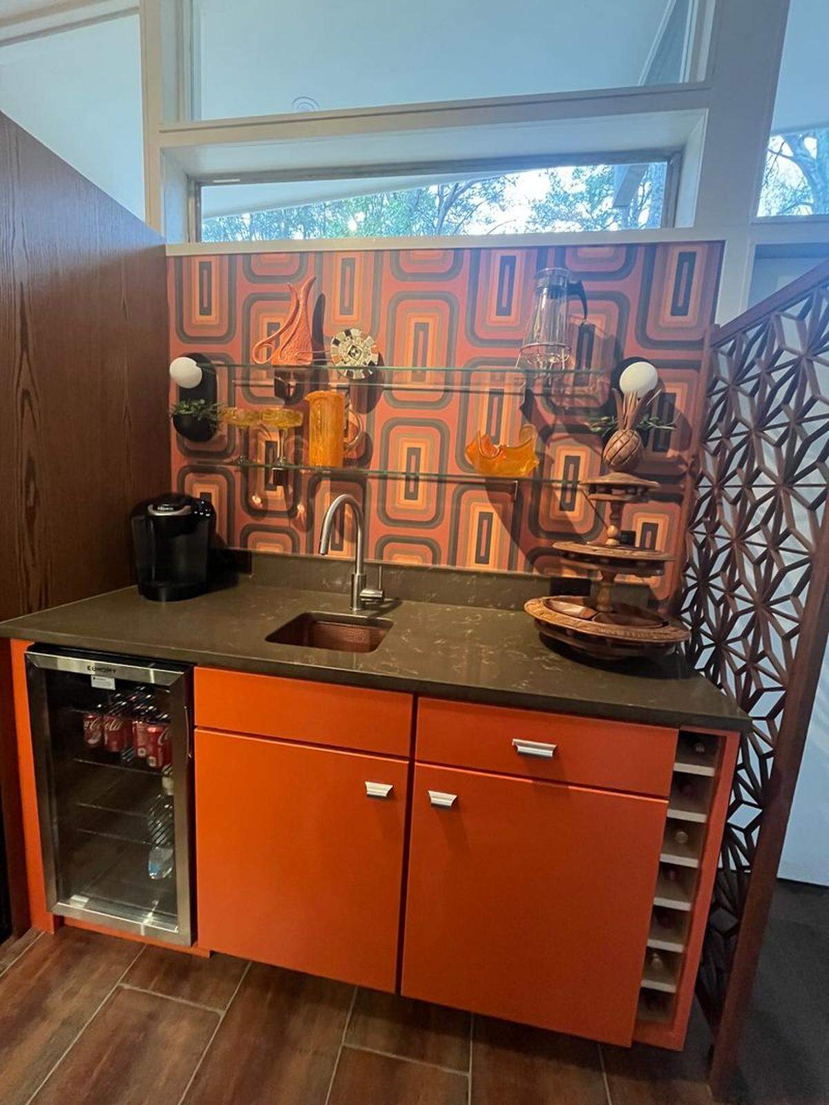An original bar cabinet at the Bill and Betty Webber House at 1512 Delmont Drive in the Avent West neighborhood near Lake Johnson.