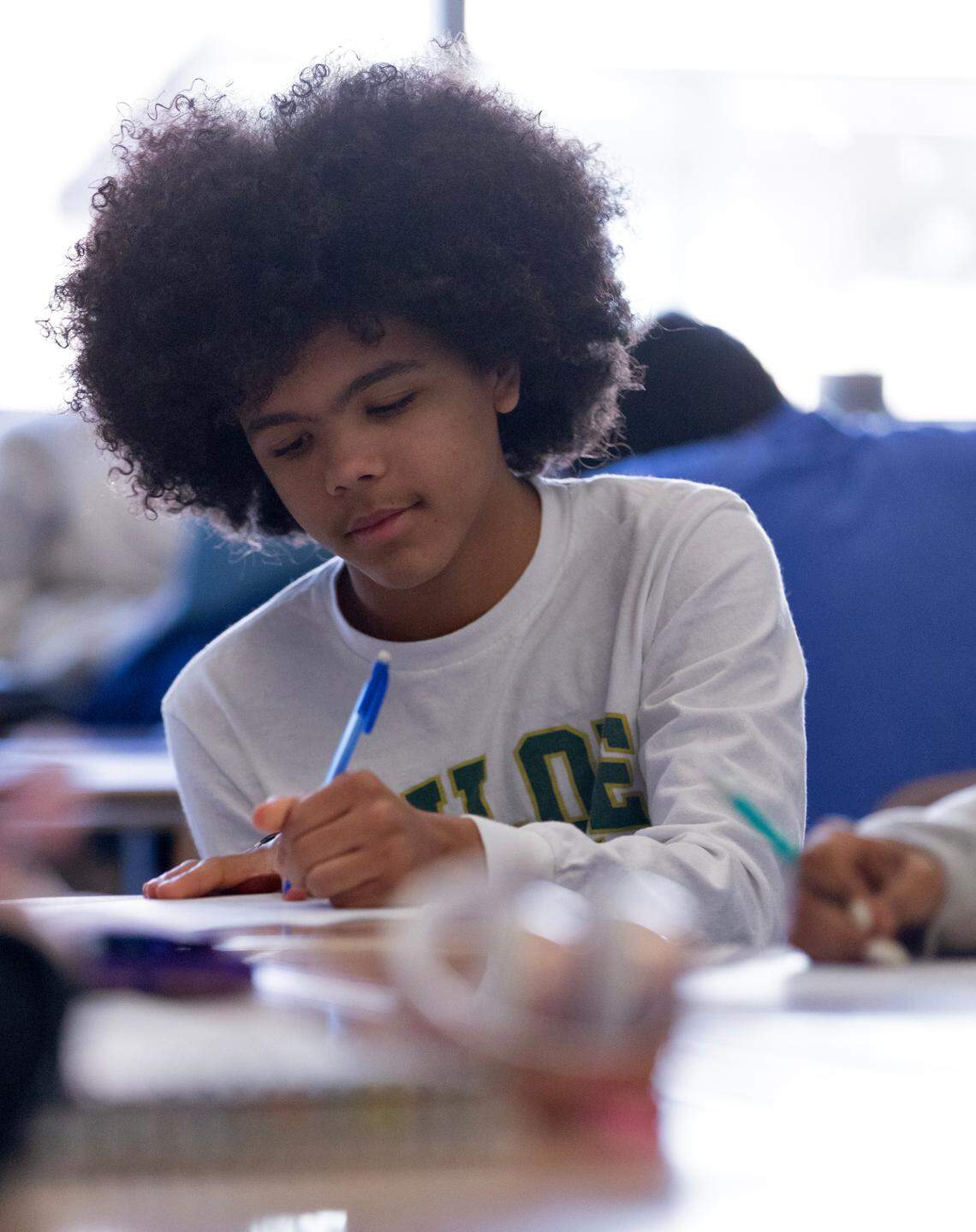 Sophomore Harper Grimmett takes notes during a lecture in an AP World History class at Enloe High School on Monday, March 3, 2025, in Raleigh, N.C.