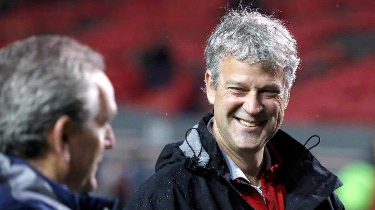 N.C. State Athletic Director Boo Corrigan, right, laughs with UNC Athletic Director Bubba Cunningham before N.C. State’s game against North Carolina at Carter-Finley Stadium in Raleigh, N.C., Saturday, November 30, 2019.