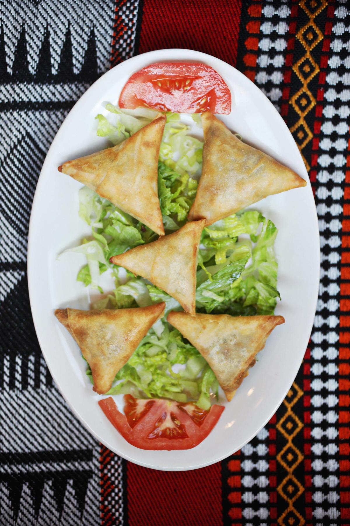 Yemen Kitchen’s sambousa, like India’s samosa, is a triangular pastry with your choice of meat or vegetable filling. The pastry in the Yemeni version is a wonton wrapper and the filling options - ground beef, or a medley of cabbage, corn, diced red bell pepper and parsley - are distinctly Yemeni.