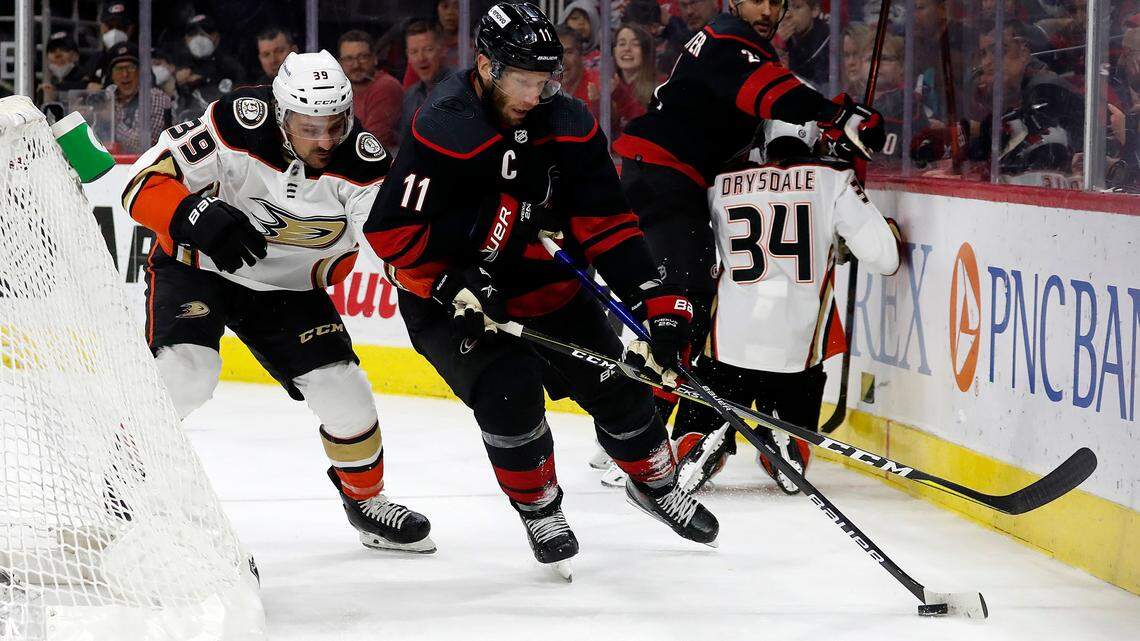 Carolina Hurricanes’ Jordan Staal (11) controls the puck in front of Anaheim Ducks’ Sam Carrick (39) during the second period of an NHL hockey game in Raleigh, N.C., Sunday, April 10, 2022. (AP Photo/Karl B DeBlaker)