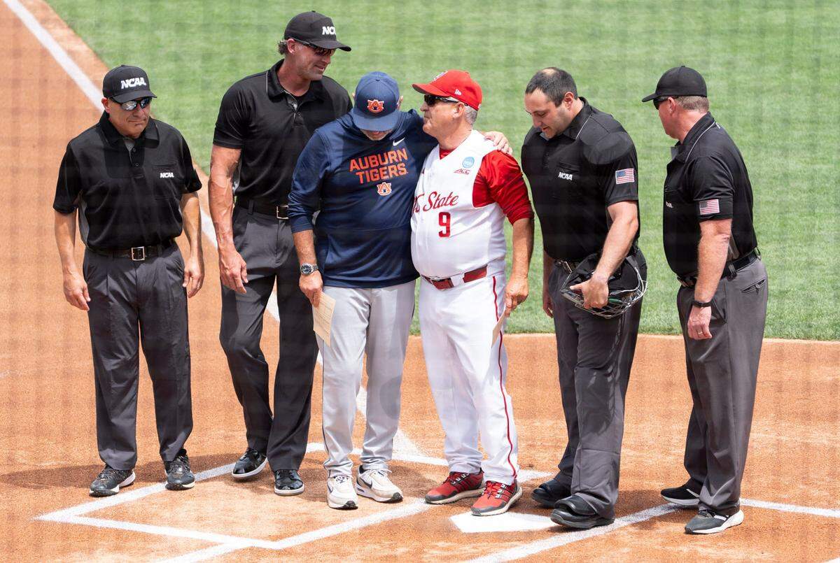 Auburn Tigers head coach Butch Thompson and NC State Wolfpack head coach Elliott Avent talk before the game as Auburn Tigers take on NC State Wolfpack during the NCAA Regional Baseball tournament at Plainsman Park in Auburn, Ala. on Saturday, May 30, 2026.
