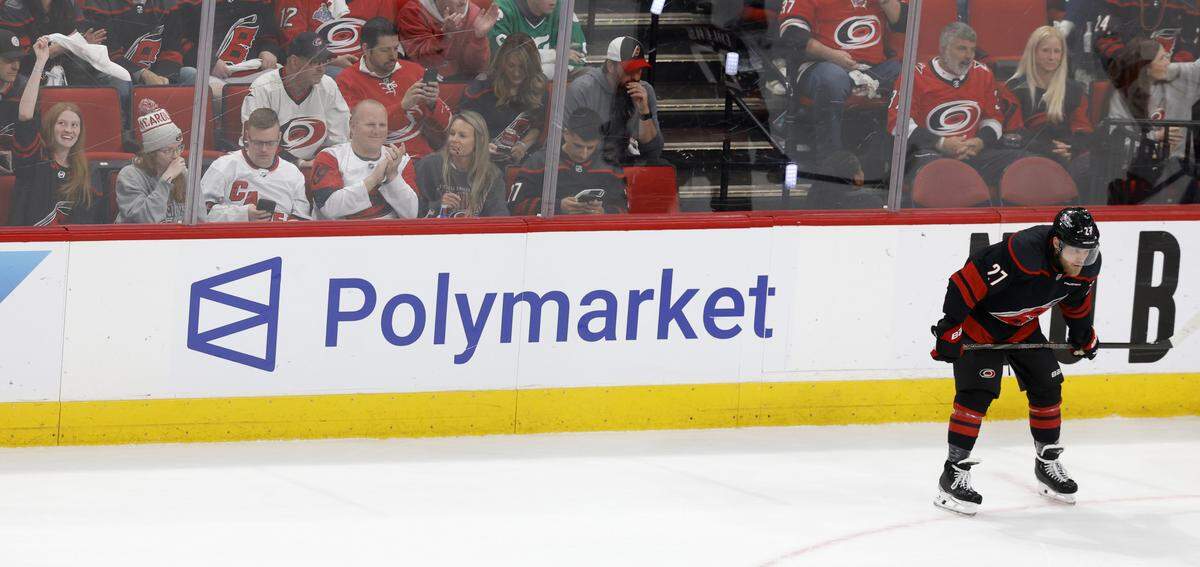 A Polymarket ad is seen on the boards at the Lenovo Center in Raleigh, photographed during the Hurricanes’ game against the Canadiens in game two of the Eastern Conference Finals on May 23, 2026.
