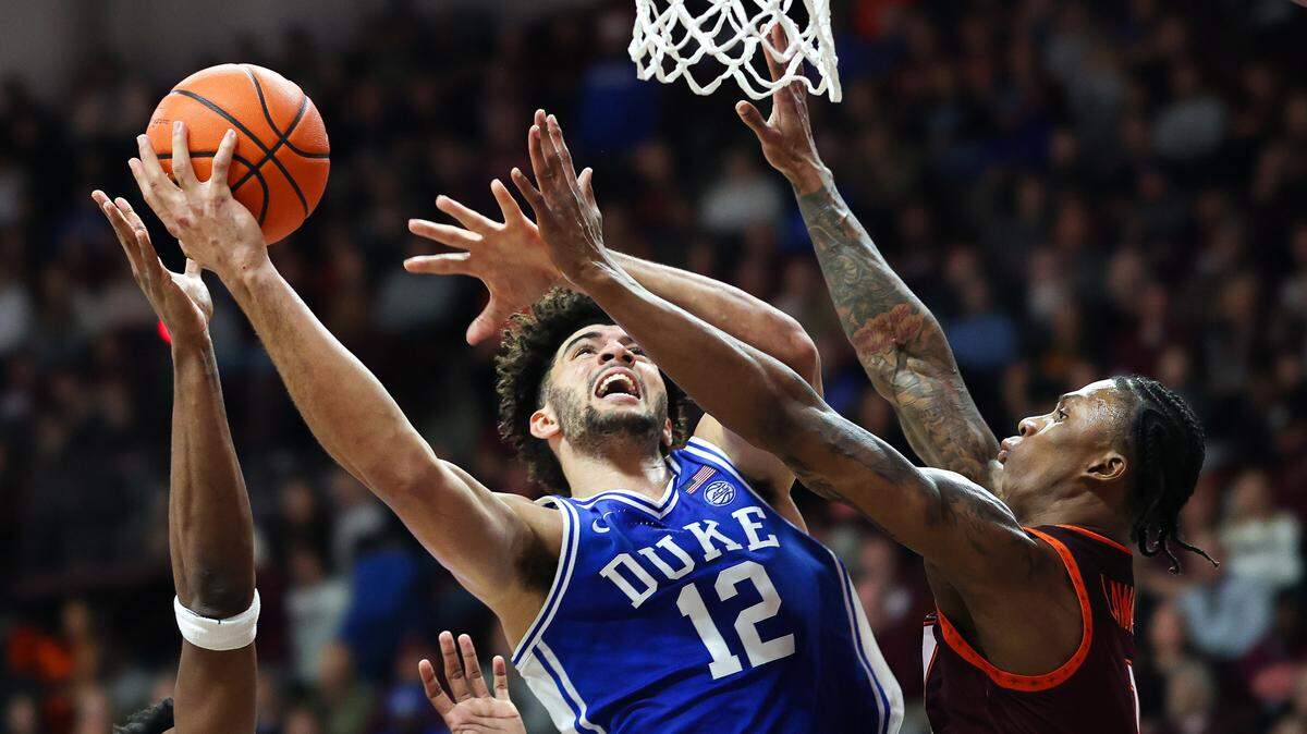 Duke’s Cameron Boozer shoots over Tobi Lawal (1) of the Virginia Tech Hokies in the second half during at Cassell Coliseum on January 31, 2026 in Blacksburg, Virginia.  