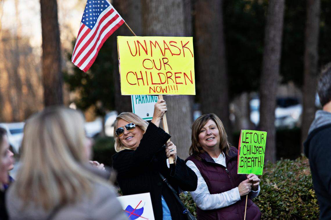 A crowd of around 100 people rallied outside Tuesday’s Wake County school board meeting in Cary Feb. 15, 2022, demanding that the district immediately stop mandating that students wear masks. Event participants want the school board to vote Tuesday or to call a special meeting by next week to vote on making masks optional.