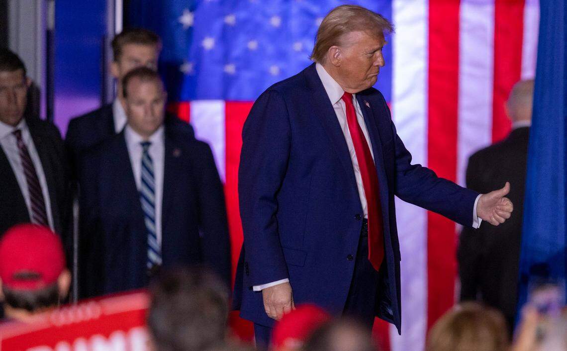Former President Donald Trump takes the stage during a rally at Minges Coliseum in Greenville on Monday, Oct. 21, 2024. With two weeks until Election Day, Trump went on a three-city tour, in which Trump will also see the destruction caused by Hurricane Helene in Asheville and speak at a faith conference in Concord.