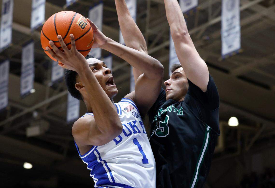 Duke’s Caleb Foster (1) drives to the basket as Dartmouth’s Jackson Munro (33) defends during the first half of Duke’s game against Dartmouth at Cameron Indoor Stadium in Durham, N.C., Monday, Nov. 6, 2023.