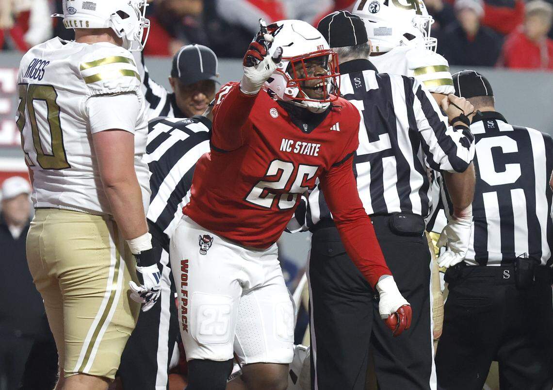 N.C. State’s Joseph Adedire (25) celebrates after the defense stopped Georgia Tech on third and goal during the second half of N.C. State’s 48-36 victory over Georgia Tech at Carter-Finley Stadium in Raleigh, N.C., Saturday, Nov. 1, 2025.