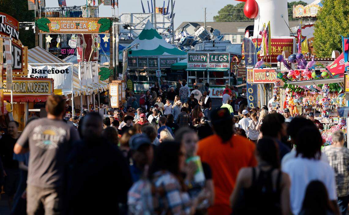 Fairgoers attend the N.C. State Fair in Raleigh, N.C., Thursday, Oct. 12, 2023.