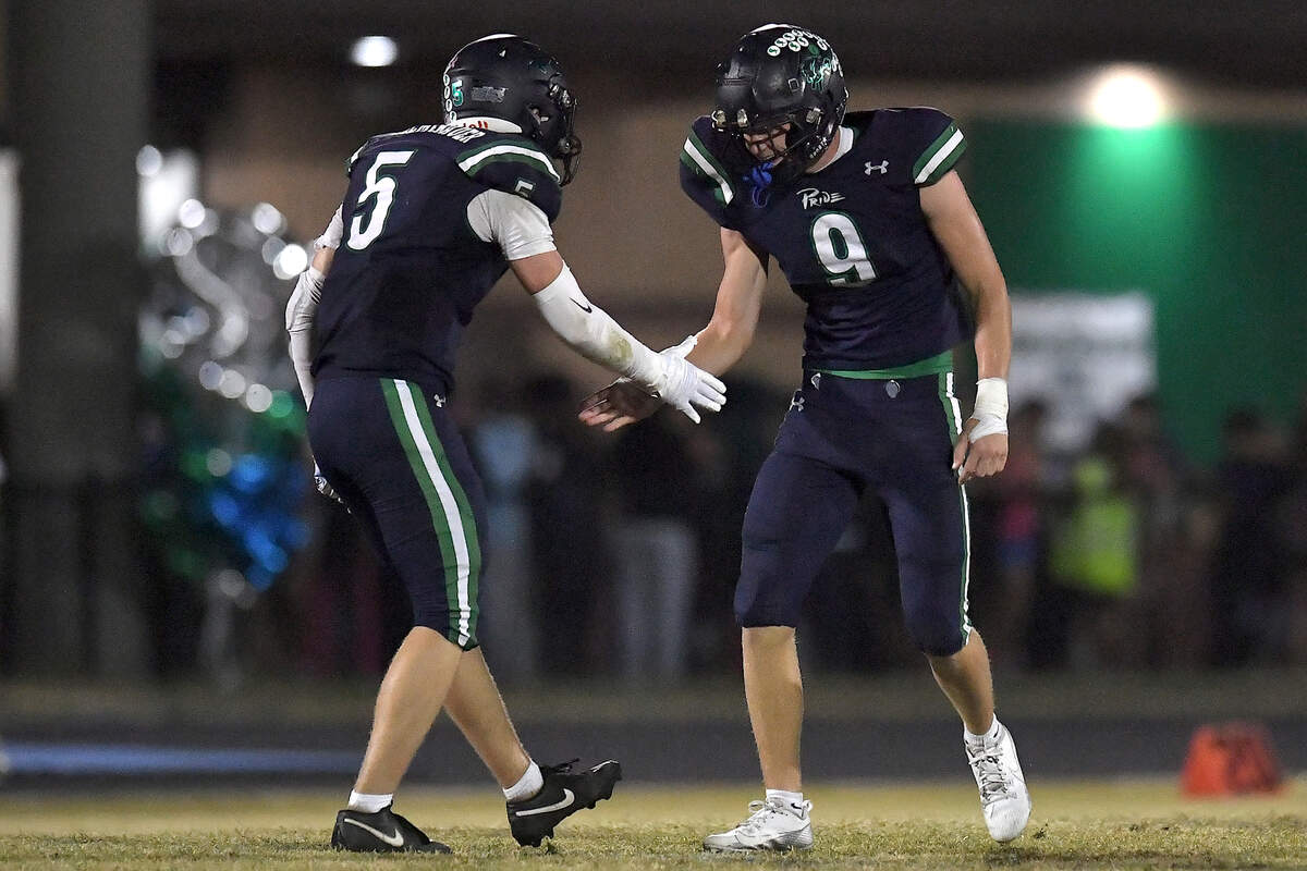 Leesville Road’s Derek Schemenauer (5) celebrates Sam White’s (9) sack of Gibbons quarterback Gannon Jones during the second half. The Leesville Road Pride and the Cardinal Gibbons Crusaders met in a conference football game in Raleigh, N.C. on November 1, 2024.