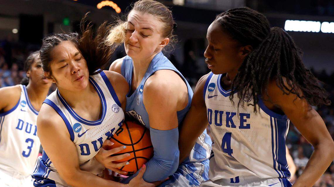 North Carolina’s Alyssa Ustby battles for possession with Duke’s Vanessa de Jesus and Jadyn Donovan during the first half of the teams’ NCAA Tournament Sweet 16 matchup at Legacy Arena on Friday, March 28, 2025, in Birmingham, Ala.