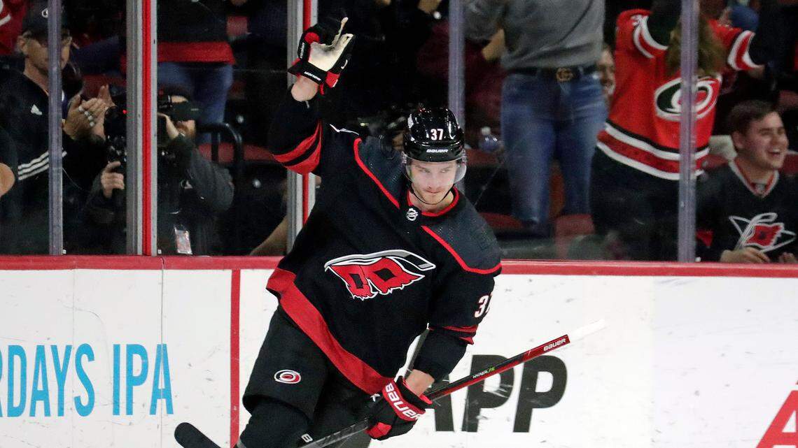 Carolina Hurricanes right wing Andrei Svechnikov (37) celebrates after he put the puck past Washington Capitals goaltender Darcy Kuemper during the shootout period of an NHL hockey game Monday, Oct. 31, 2022, in Raleigh, N.C. It proved to be the winning goal. (AP Photo/Chris Seward)