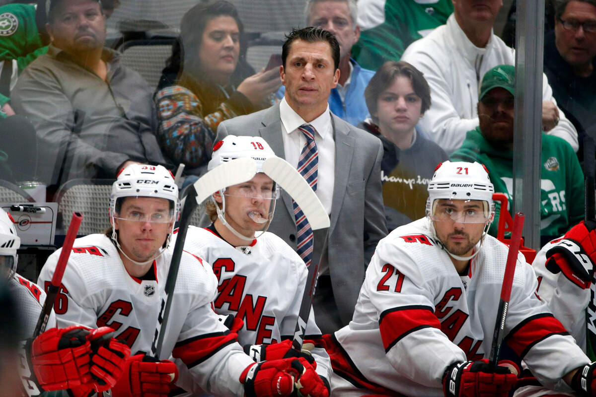 Carolina Hurricanes head coach Rod Brind’Amour watches his team play the Dallas Stars with left wing Erik Haula (56) center Ryan Dzingel (18) and right wing Nino Niederreiter (21) during the first period of an NHL hockey game in Dallas, Tuesday, Feb. 11, 2020.