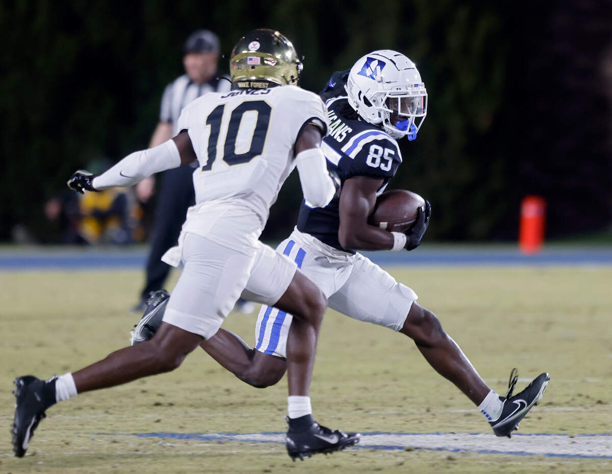 Duke’s Sahmir Hagans runs the ball by Wake Forest’s DaShawn Jones during the second half of the Blue Devils’ final regular season game at Wallace Wade Stadium on Saturday, Nov. 26, 2022, in Durham, N.C.