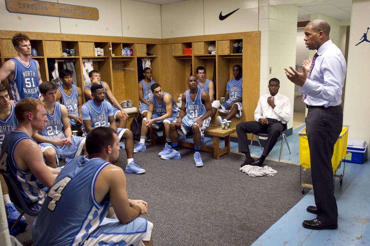UNC JV coach Hubert Davis talks with his team in the locker room prior to their first game against Mt. Olive at the Smith Center in Chapel Hill, N.C. on November 11, 2013.