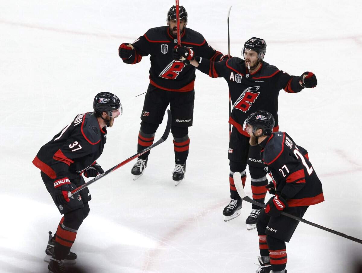 Carolina's Andrei Svechnikov (37) celebrates with Nikolaj Ehlers (27) after scoring in the second period.