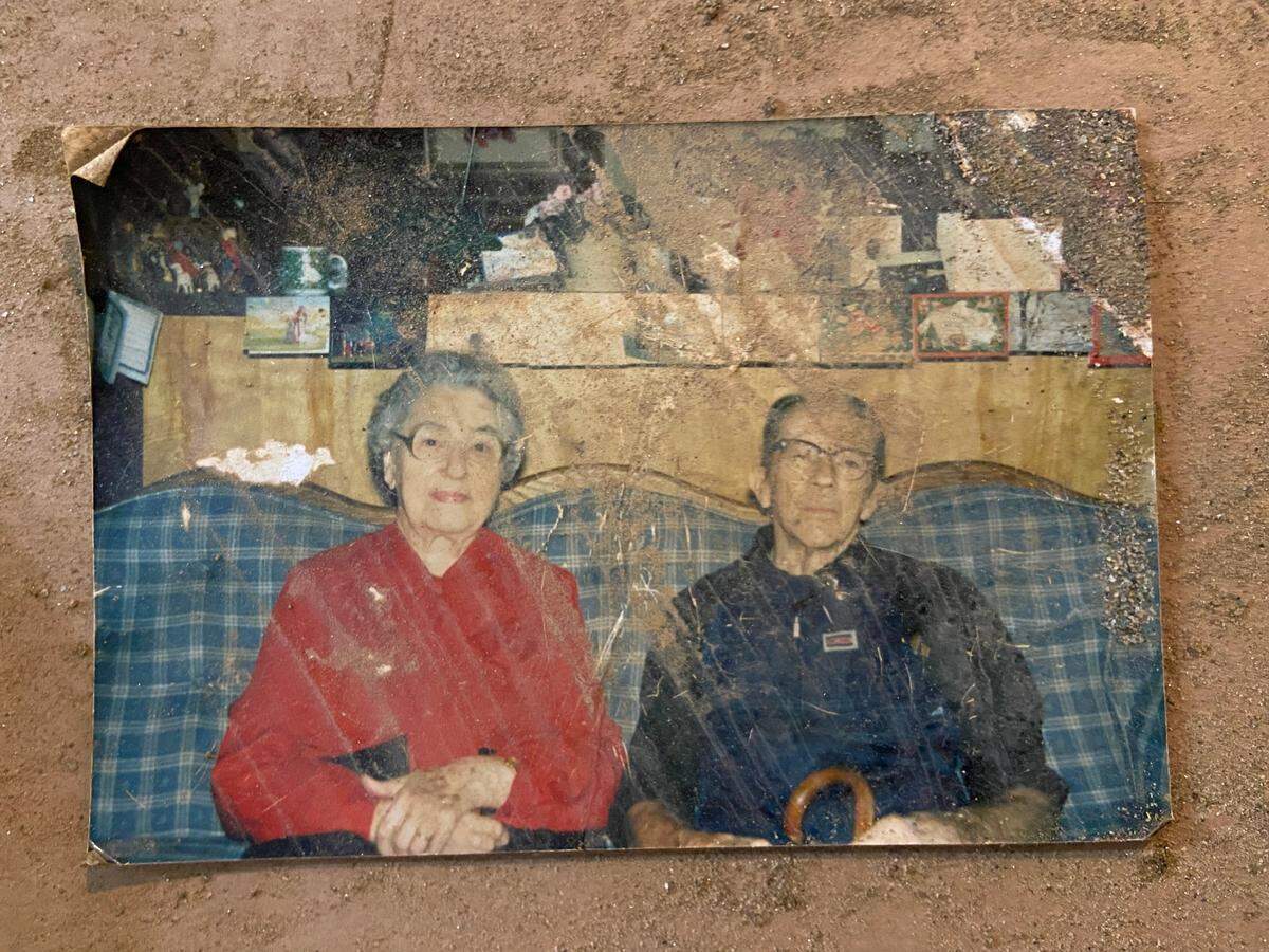 A photograph of unknown people found along the Swannanoa River after Hurricane Helene