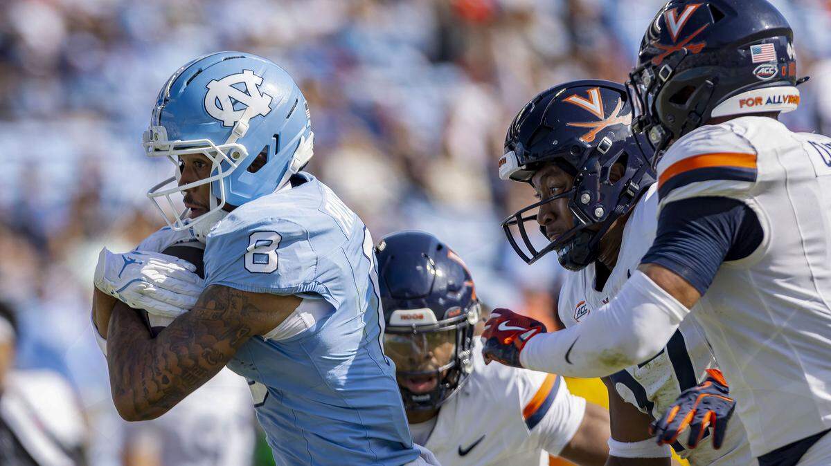 North Carolina wide receiver Kobe Paysour (8) picks up 26-yards on a pass reception from quarterback Gio Lopez in the second quarter to set up a touchdown against Virginia on Saturday, October 25, 2025 at Kenan Stadium in Chapel Hill, N.C.