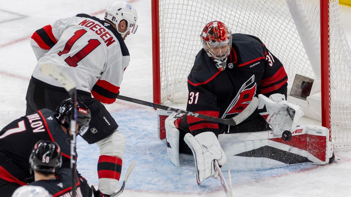 Carolina Hurricanes goalie Frederik Andersen (31) stops a scoring attempt by New Jersey right wing Stefan Noesen (11) in the third period during game two of their Stanley Cup playoff series on Tuesday, April 22, 2025 at Lenovo Center in Raleigh, N.C.