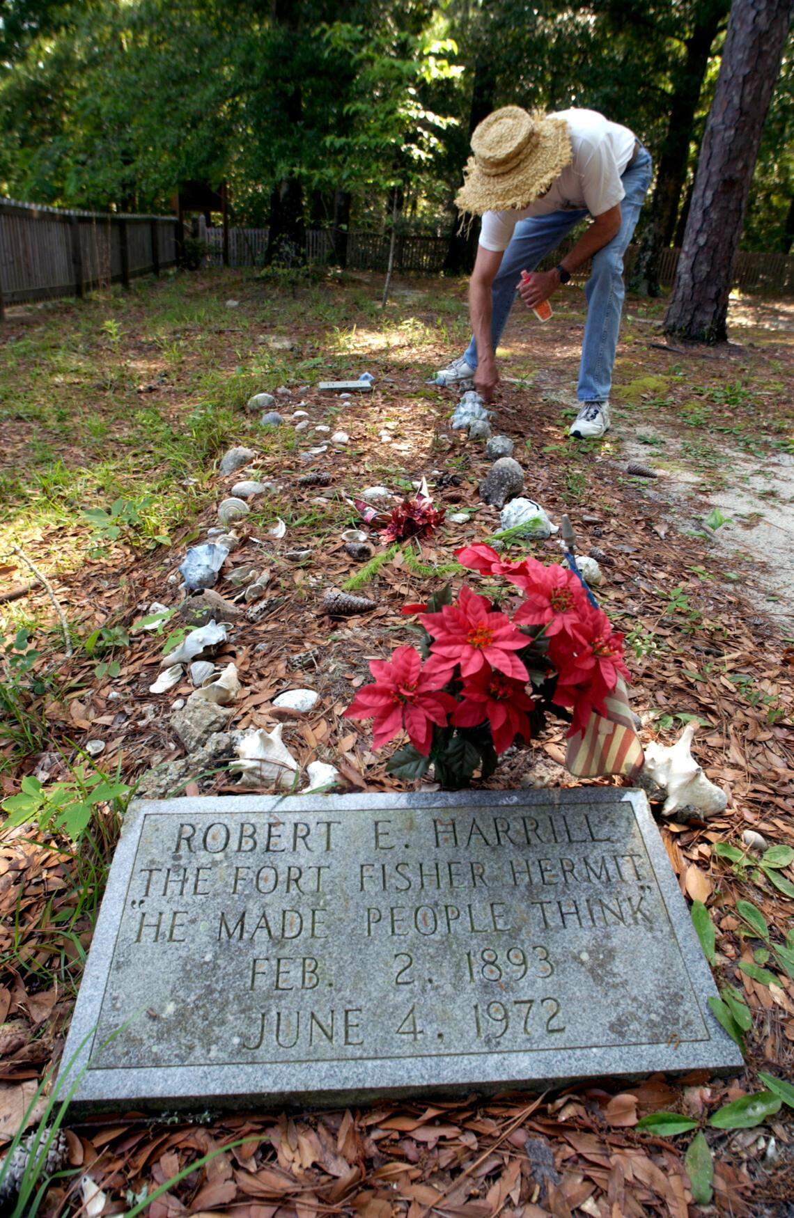 Hermit1.SJ.051202.MBN - Fort Fisher, NC - 05/12/02 - Mike Edwards, President of the Hermit Society, visits the grave of Robert Harrill, the Fort Fisher Hermit. Staff/Mel Nathanson.