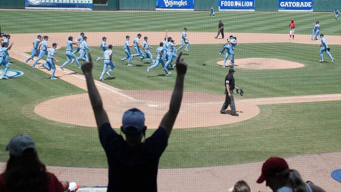 North Carolina players rush onto the field after the last out in UNC’s 9-5 victory over N.C. State in the ACC baseball championship at Truist Field in Charlotte, N.C., Sunday, May 29, 2022.