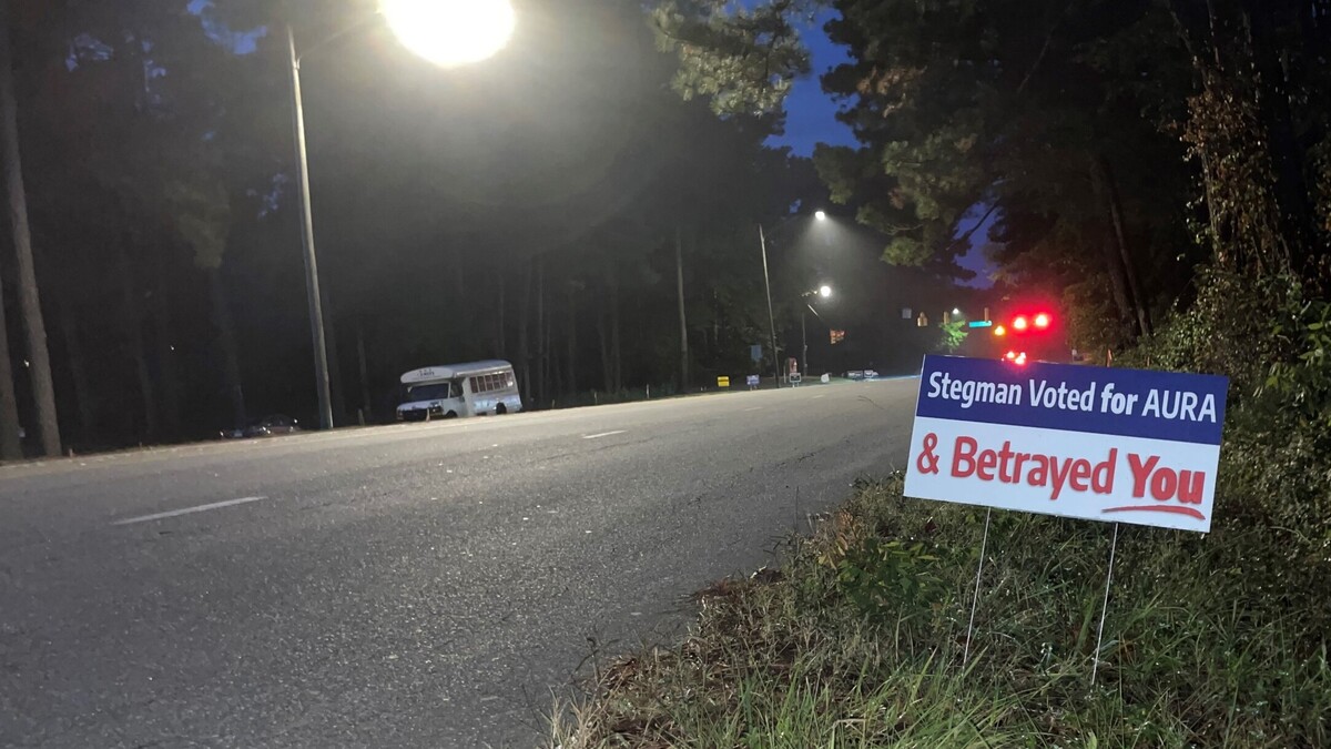Signs posted on three legs of the Estes Drive-Martin Luther King Jr. Boulevard intersection call out incumbent Council member Karen Stegman, who voted for the Aura Chapel Hill mixed-use development and is running for re-election in November.