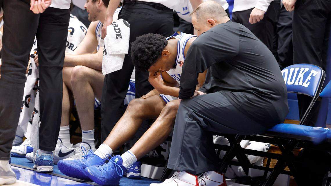 Duke’s Jeremy Roach (3) sits on the bench with trainer Jose Fonseca after coming off the floor for the second time during Duke’s 84-79 victory over Georgia Tech at Cameron Indoor Stadium in Durham, N.C., Saturday, Jan. 13, 2024.