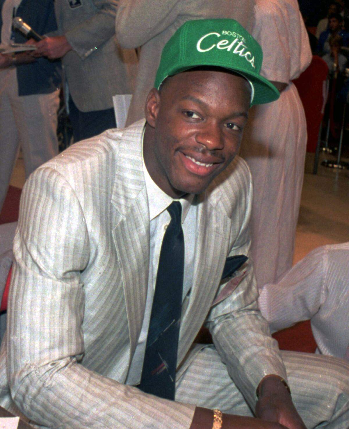 Len Bias wears a Boston Celtics hat after being selected as the No. 2 pick in the NBA draft in New York, June 17, 1986. Two days later, on June 19, Bias died of a cocaine overdose in a Maryland dormitory room during a party to celebrate his success. (AP Photo/File)