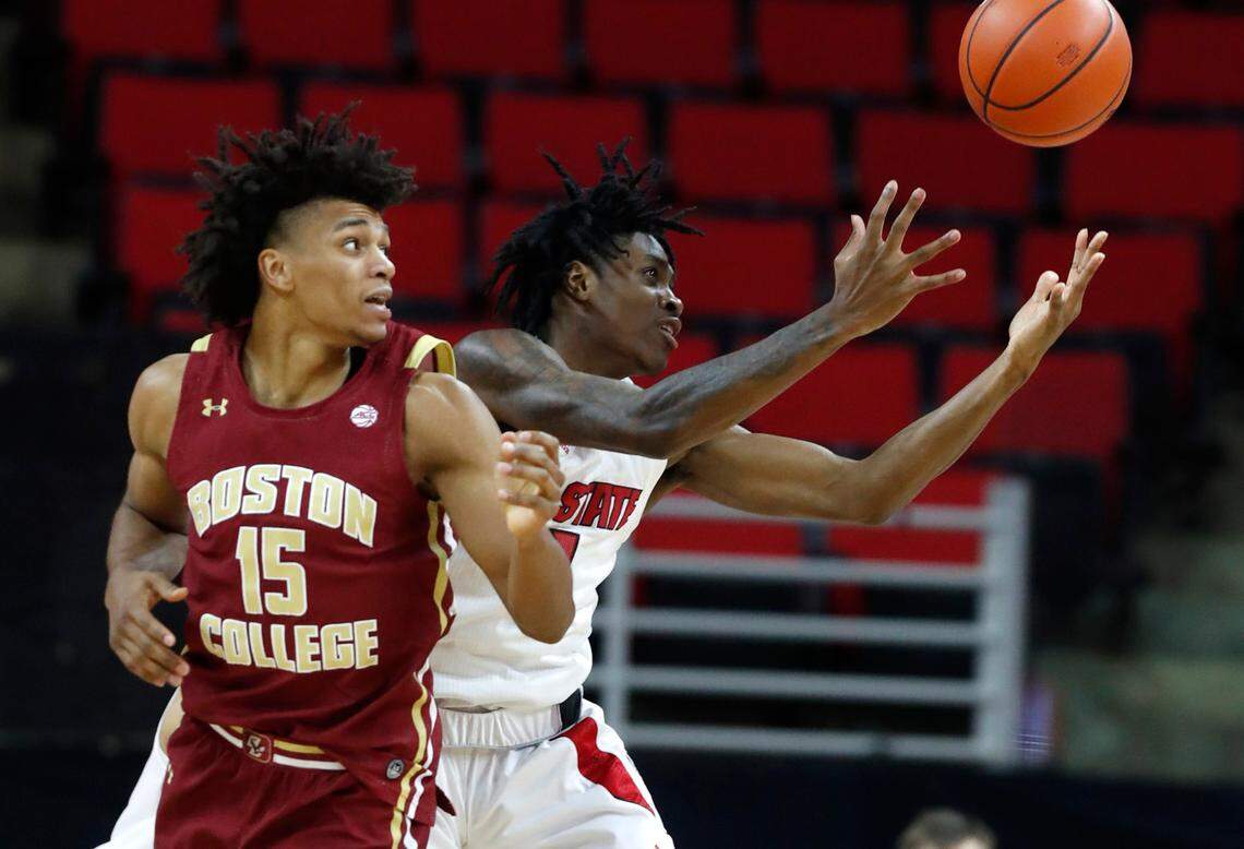 N.C. State’s Dereon Seabron (1) pulls in the rebound from Boston College’s Demarr Langford Jr. (15) during the second half of N.C. State’s 79-76 victory over Boston College at PNC Arena in Raleigh, N.C., Wednesday, December 30, 2020.