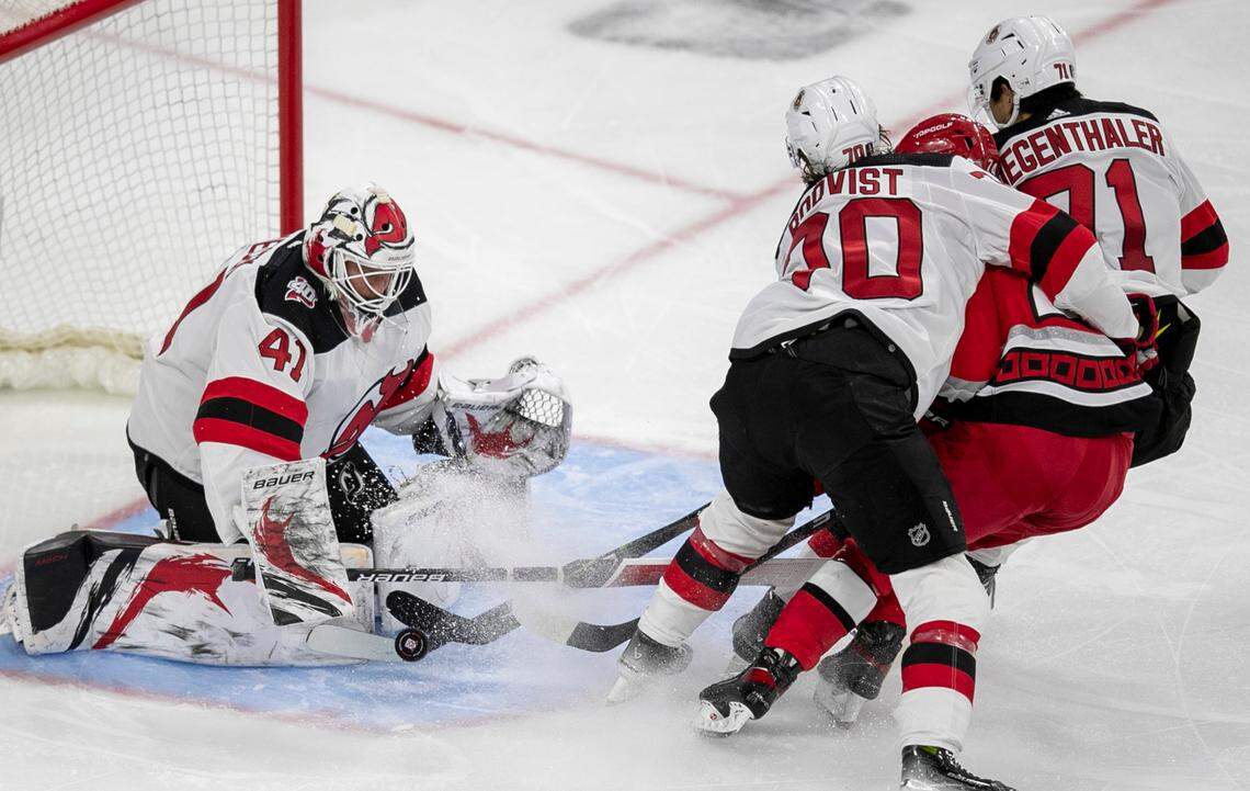 The New Jersey Devils Jesper Boqvist (70) and goalie Vivek Vanecek (41) stop a scoring attempt by the Carolina Hurricanes Seth Jarvis (24) in the third period during Game 1 of their second round Stanley Cup playoff series on Wednesday, May 3, 2023 at PNC Arena in Raleigh, N.C.