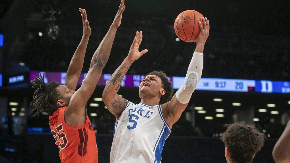 Dukeís Paolo Banchero (5)drives to the basket against Virginia Techís Justyn Mutts (25) in the first half during the ACC Tournament Championship on Saturday, March 12, 2022 at Barclays Center in Brooklyn, N.Y.