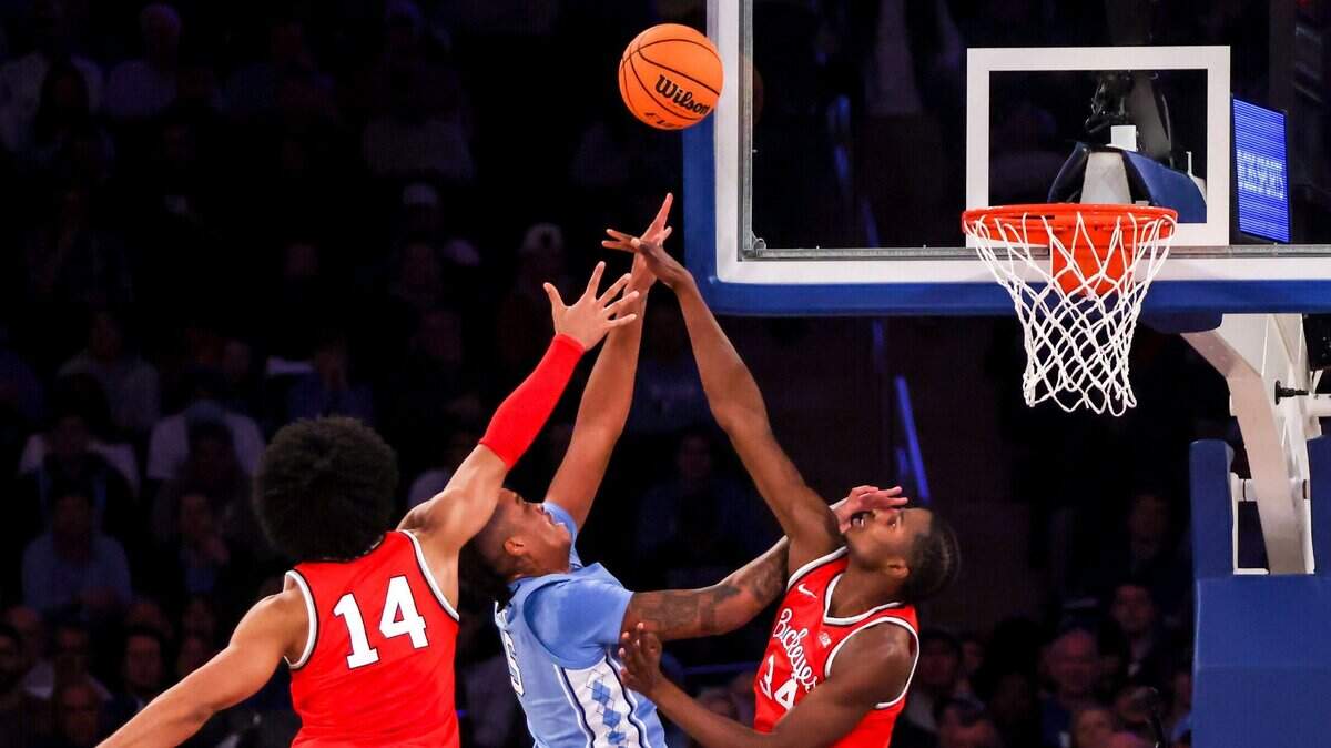 Ohio State forward Justice Sueing (14), center Felix Okpara (34) and North Carolina forward Armando Bacotrise up for the ball during the first half of an NCAA college basketball game in the CBS Sports Classic, Saturday, Dec. 17, 2022, in New York. (AP Photo/Julia Nikhinson)