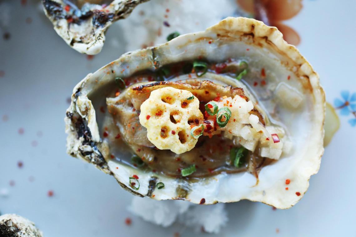 The Honeycomb Oysters are a half dozen oysters, gently warmed and finished with honey butter, apple mignonette, espelette pepper, and a garnishing crown of Honeycomb cereal.