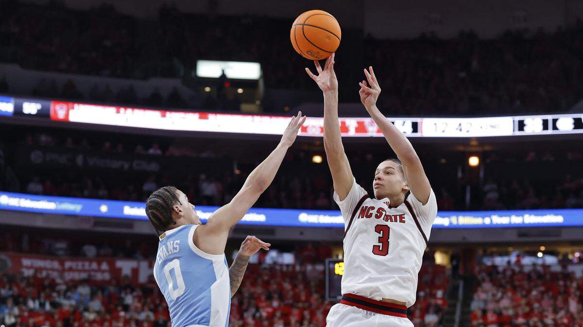 N.C. State’s Matt Able shoots over North Carolina’s Kyan Evans during the second half of the Wolfpack’s 82-58 win on Tuesday, Feb. 17, 2026, at Lenovo Center in Raleigh, N.C.