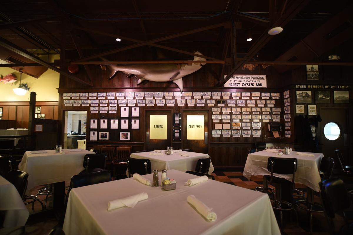 One wall of 42nd Street Oyster bar is covered with license plates donated by notable North Carolina politicians who dined at the restaurant. 