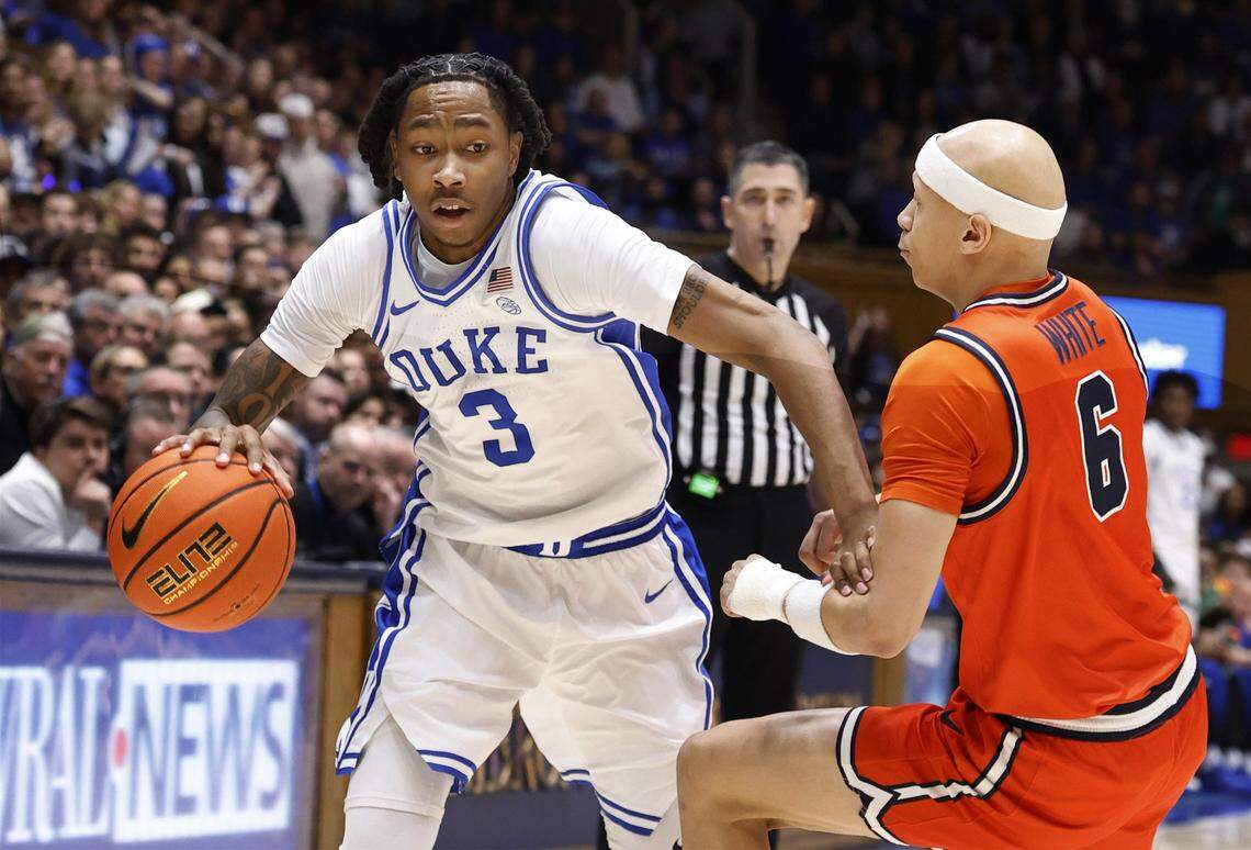 Duke’s Isaiah Evans (3) drives around Virginia's Jacari White (6) during the first half of Duke’s game against Virginia at Cameron Indoor Stadium in Durham, N.C., Saturday, Feb. 28, 2026.