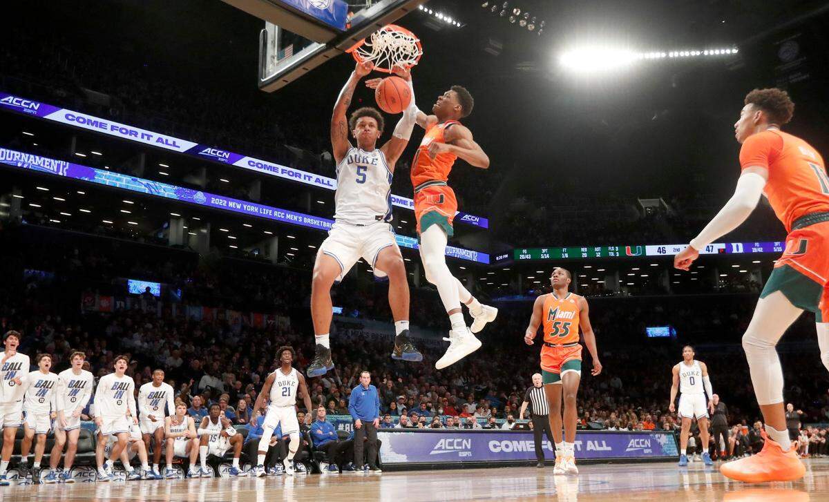 Dukes Paolo Banchero (5) slams in two as Miami’s Anthony Walker (1) defends during Dukes 80-76 victory over Miami in the semifinals of the ACC mens basketball tournament at the Barclays Center in Brooklyn, N.Y., Friday, March 11, 2022.