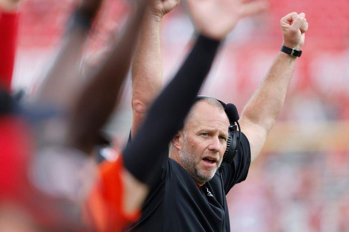 N.C. State head coach Dave Doeren celebrates after the Wolfpack scored during the second half of N.C. States 55-3 victory over Charleston Southern at Carter-Finley Stadium in Raleigh, N.C., Saturday, Sept. 10, 2022.