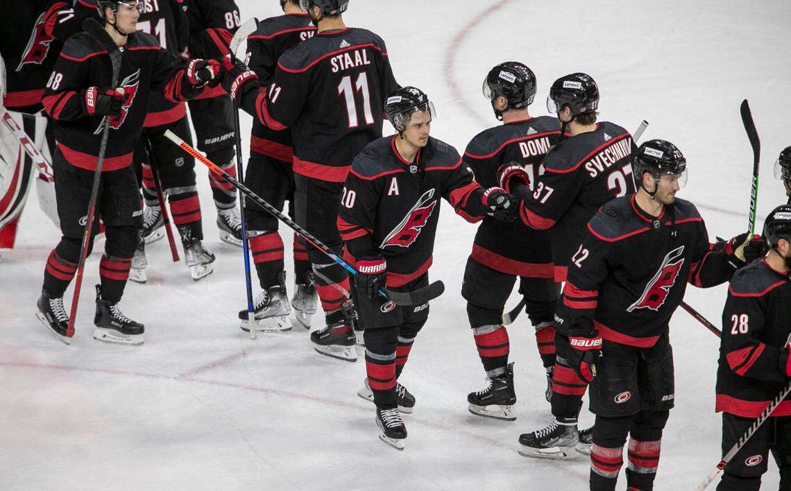 Carolina Hurricanes Sebastian Aho (20) and his teammates celebrate following their 5-1 victory over Boston on Tuesday, May 10, 2022 during game five of their of their Stanley Cup first round series at PNC Arena in Raleigh, N.C.