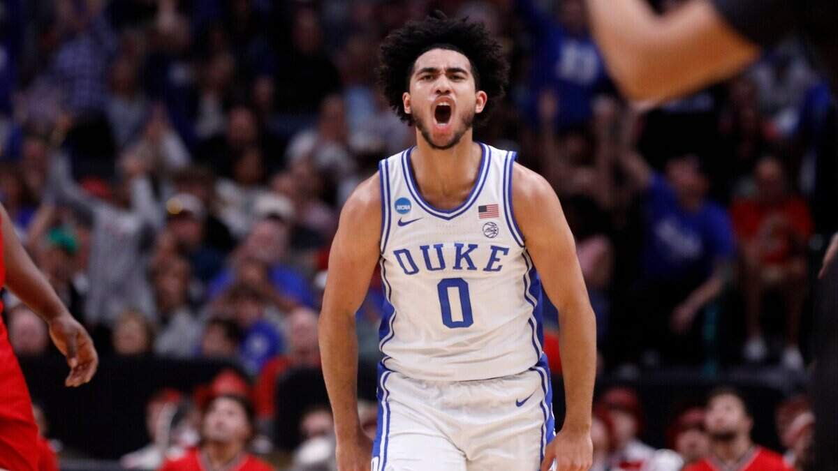 Duke’s Jared McCain celebrates after knocking down a three-pointer during the first half of the Blue Devils’ NCAA Tournament Elite Eight matchup against N.C. State on Sunday, March 31, 2024, at American Airlines Center in Dallas, Texas.