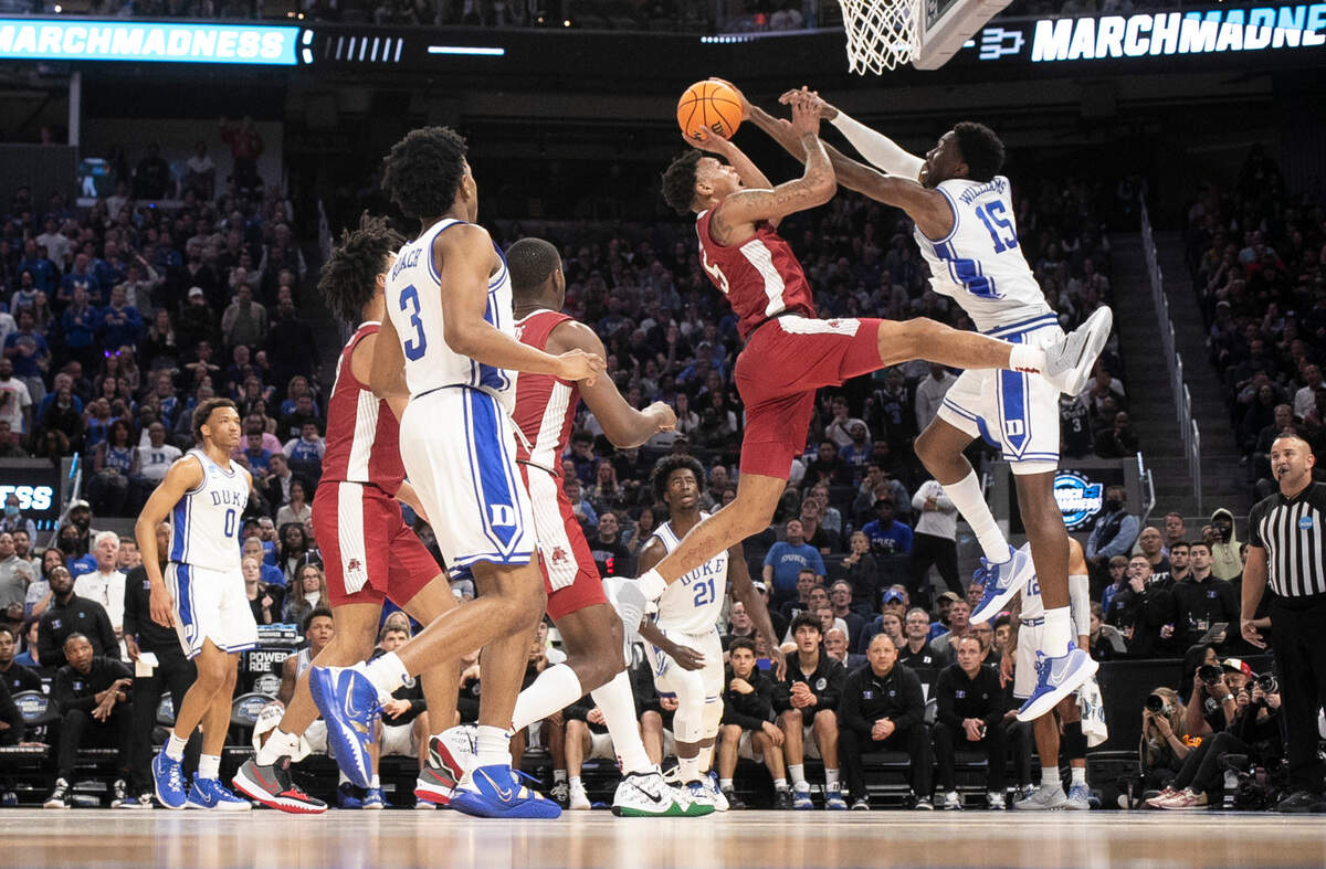 Duke’s Mark Williams (15) blocks the shot by Arkansas’ Au’Diese Toney (5) during Duke’s 78-69 victory over Arkansas in the NCAA Tournament West Regional finals at the Chase Center in San Francisco, Calif., Saturday, March 26, 2022.