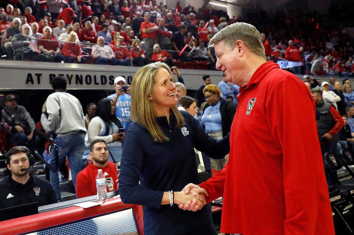 North Carolina head coach Courtney Banghart and N.C. State head coach Wes Moore share a word before their teams face off on Thursday, Feb. 1, 2024, at Reynolds Coliseum in Raleigh, N.C.