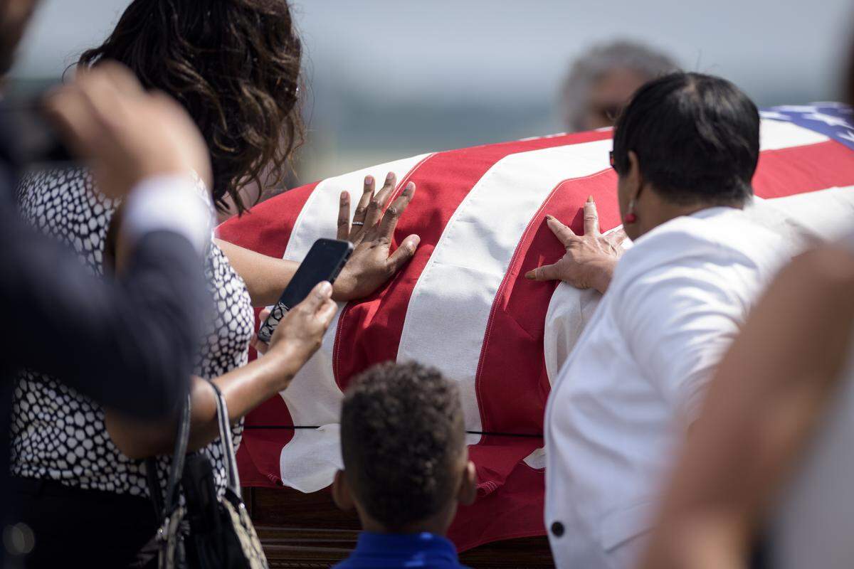 Family members of Army Pfc. William H. Jones commemorate him at RDU Airport in Raleigh, NC on June 20, 2019. Jones went missing-in-action during the Korean War on Nov 26, 1950. Several decades passed before his body was recovered after North Korea turned over 55 boxes containing the remains of American service members killed during the Korean War.