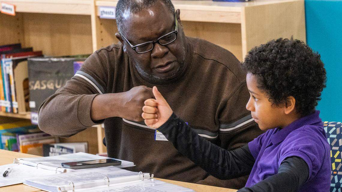 Volunteer tutor John Boyette and Wesley Volkel, 9, take part in the new WakeTogether tutoring program designed to help Wake County elementary students recover from pandemic learning loss Thursday, Nov. 17, 2022 at Southeast Raleigh Elementary School.