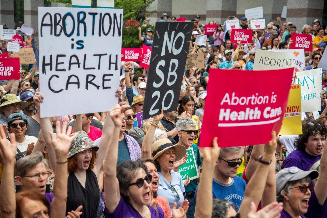 Hundreds of abortion ban veto supporters turned out to watch Gov. Roy Cooper sign a veto of the on Bicentennial Mall in Raleigh Saturday, May 13, 2023.