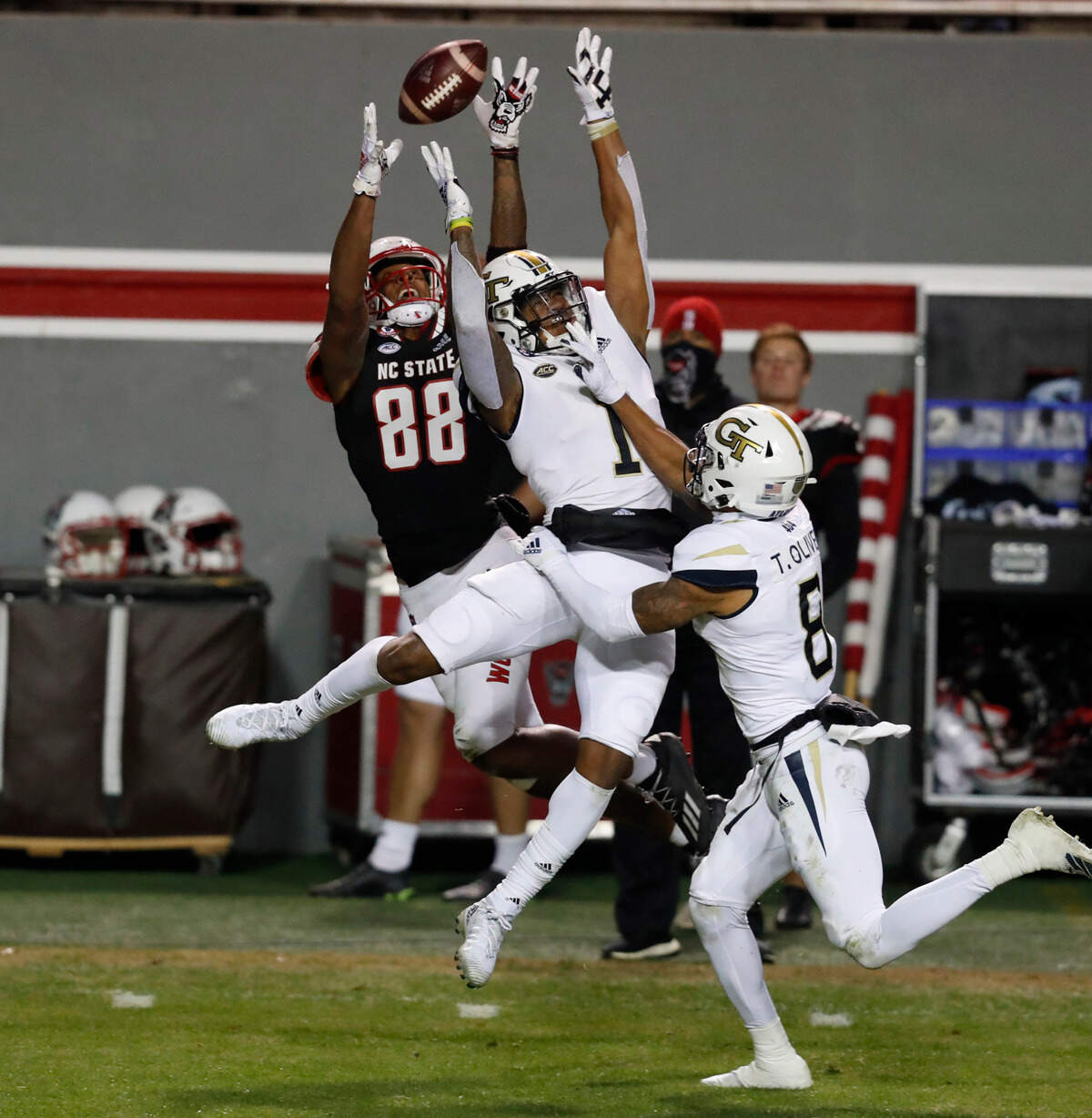 N.C. State wide receiver Devin Carter (88) makes the reception as Georgia Tech defensive back Juanyeh Thomas (1) defends during the first half of N.C. State’s game against Georgia Tech at Carter-Finley Stadium in Raleigh, N.C., Saturday, Dec. 5, 2020.