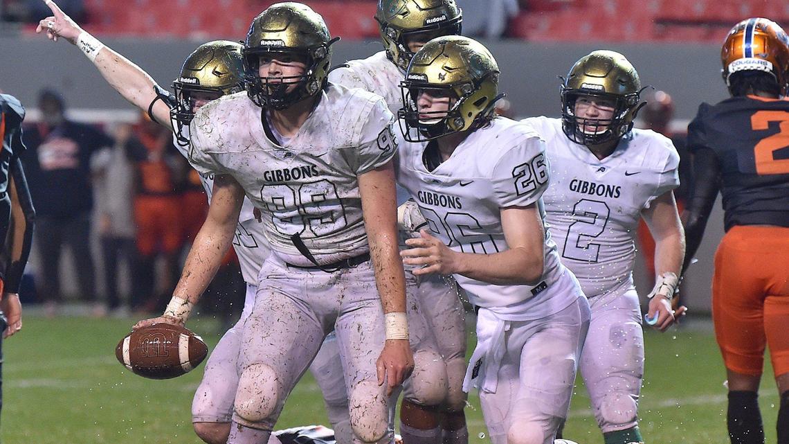 Cardinal Gibbons’ Joshua Stoneking (99) and teammates celebrate after recovering the loose ball in the first half. The Cardinal Gibbons Crusaders and the Julius Chambers Cougars met in the NCHSAA 4A Football Championship game in Raleigh, N.C. on December 11, 2021.